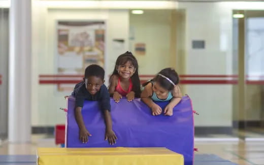 a group of children on a mat