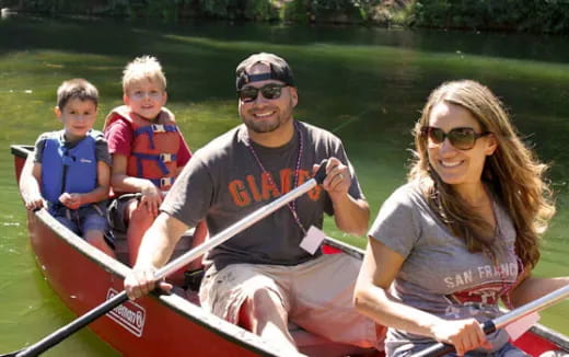a family in a canoe