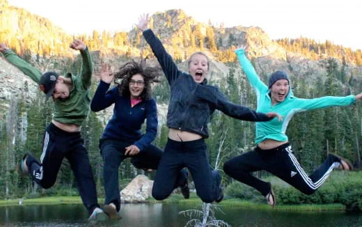 a group of people jumping in the air