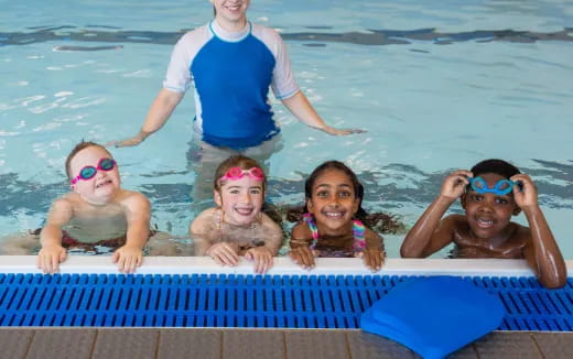 a group of kids in a pool