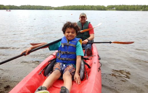 a group of people in a canoe