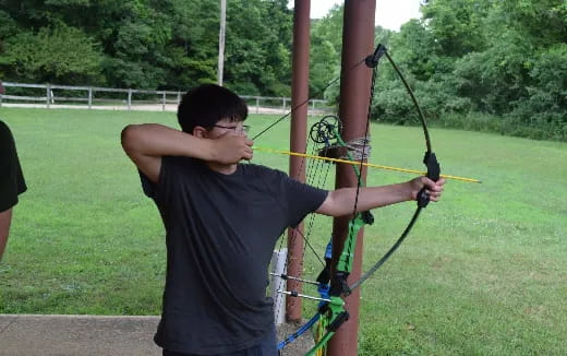a person shooting bows