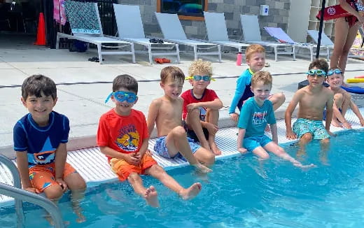 a group of kids in a pool