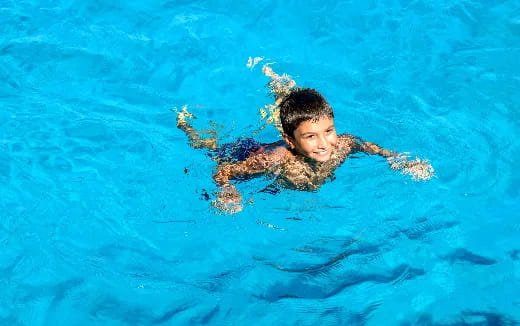 a man swimming in a pool