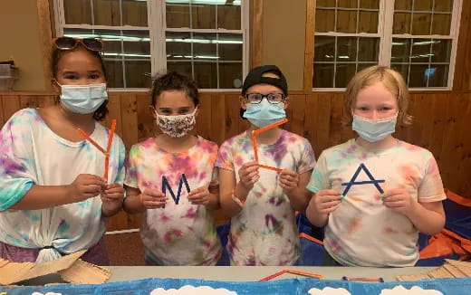 a group of children wearing face masks