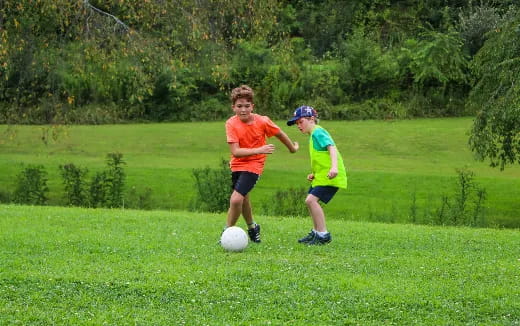 kids playing with a football ball