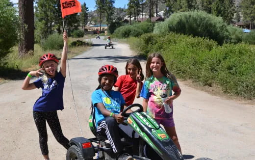 a group of children on a scooter