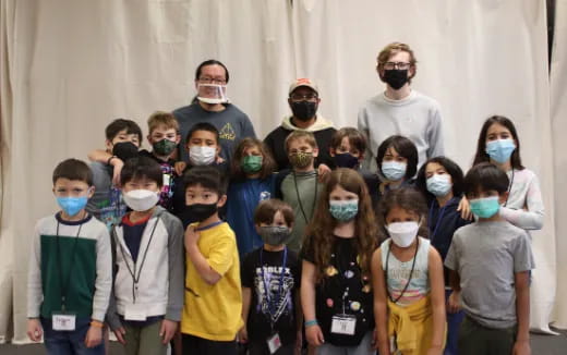 a group of people wearing masks