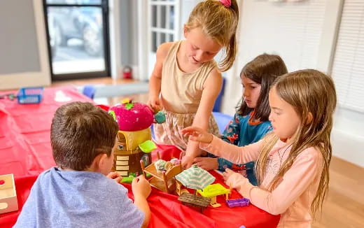 a group of children playing with toys