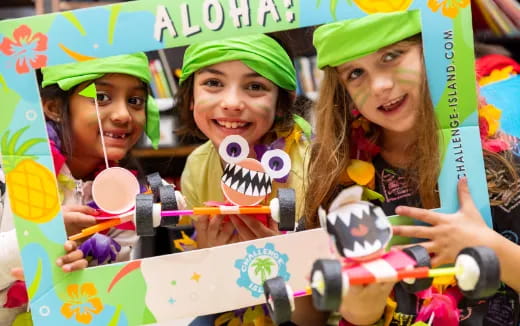 a group of girls holding toy guns