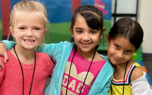 a group of girls smiling