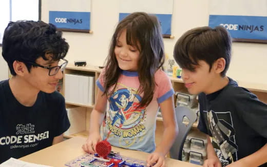 a group of kids playing with a toy