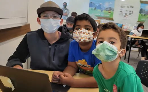 a group of children with face paint