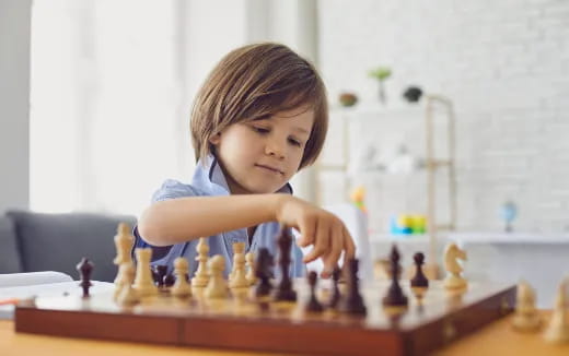 a child playing chess