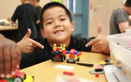 a child with his hands up