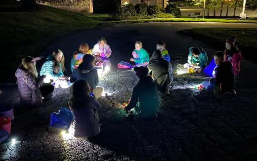 a group of people sitting in a circle in the water