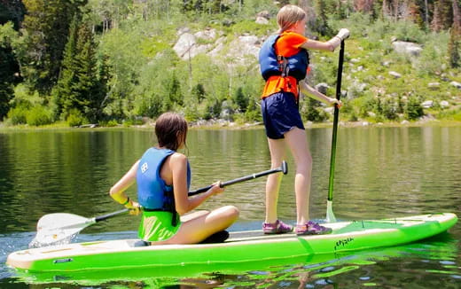 a couple of people in a canoe