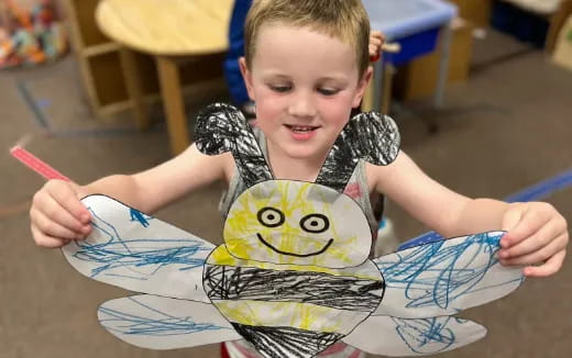 a child drawing a cartoon