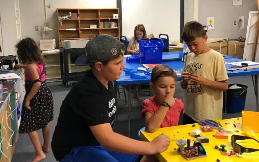 a group of children playing with toys