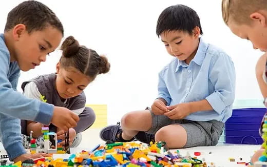 a group of children playing with toys