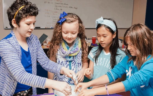 a group of young girls in a classroom