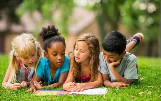 a group of children studying