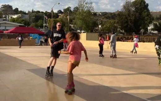 a group of people rollerblading