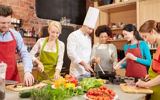 a group of people in a kitchen