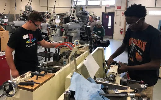 a group of people working in a factory