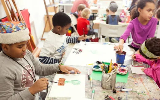 a group of children painting