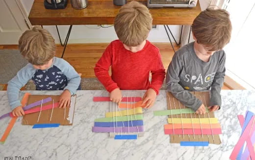 a group of kids playing with colorful blocks on the floor