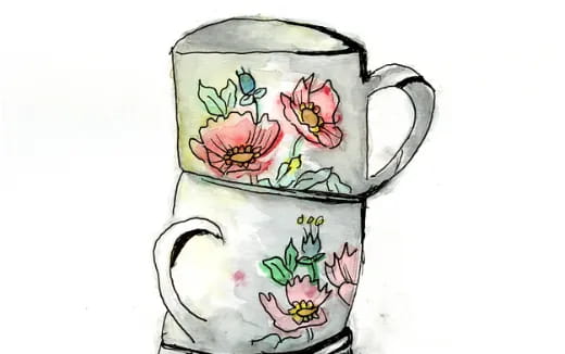 a tea cup with flowers painted on it