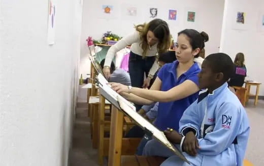 a group of children painting