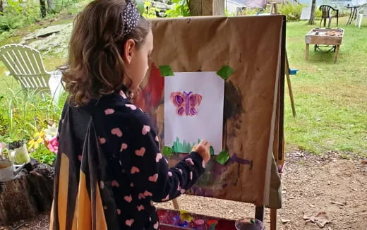 a young girl painting