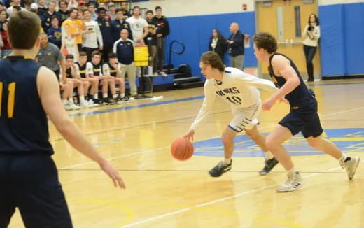 a group of people playing basketball