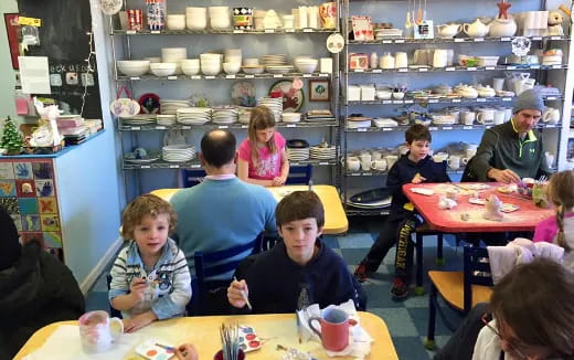 a group of people sitting at tables