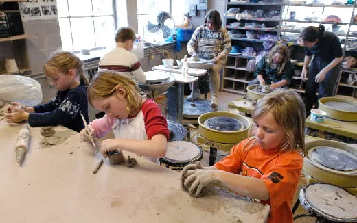 a group of children painting