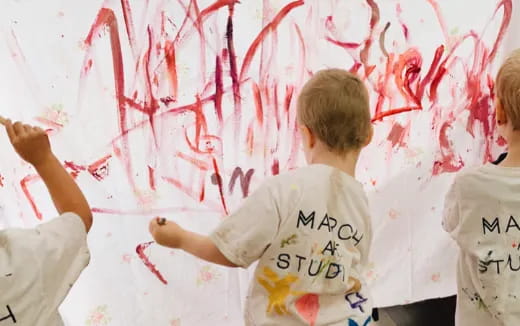 a group of people painting