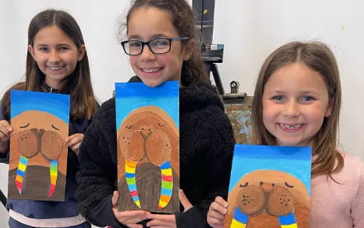 a group of girls holding books