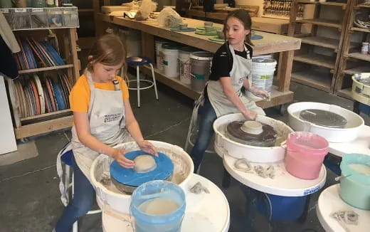 women making clay pots