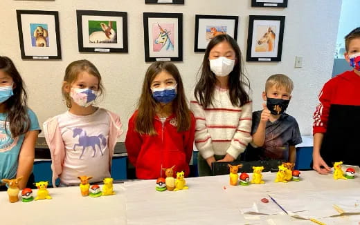 a group of children with face paint