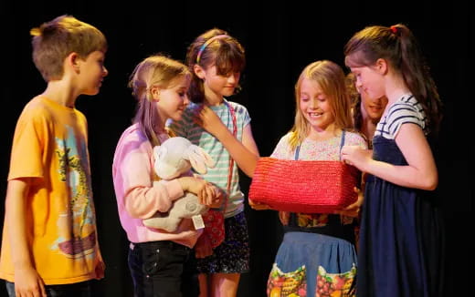 a group of people holding a baby