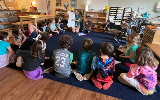 a group of children sitting on the floor