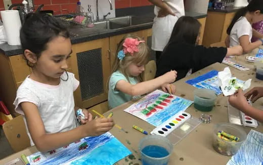 a group of children painting