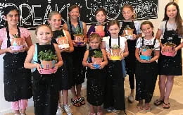 a group of girls holding flowers