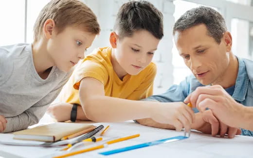 a few young boys studying