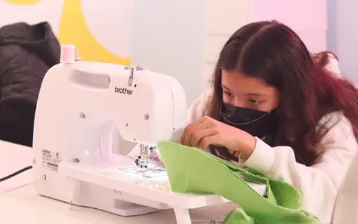 a woman using a microscope