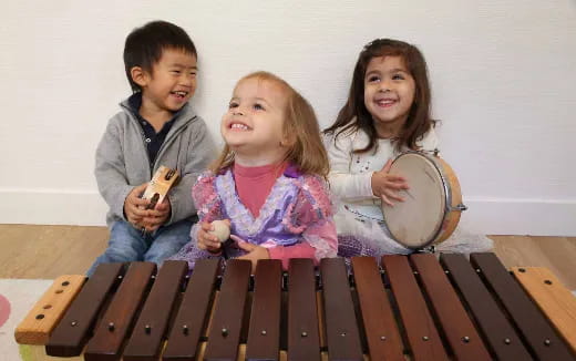 a group of children playing drums