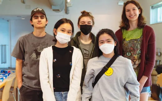 a group of people wearing masks