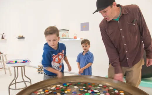 a man and a boy playing a board game